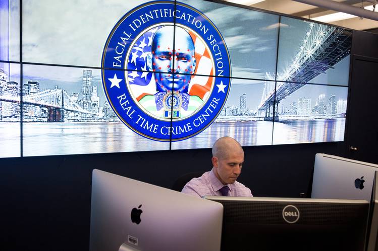 Detective Marcello Gianquinto works in the Facial Identification Section in the Real Time Crime Center at New York Police Department headquarters in lower Manhattan on March 29.